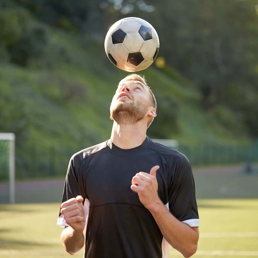 Soccer players consider protecting their heads or fitting in