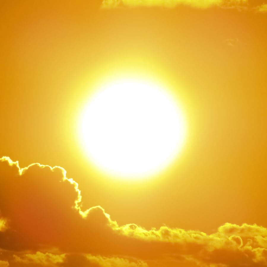 a bright sun blazing in the sky