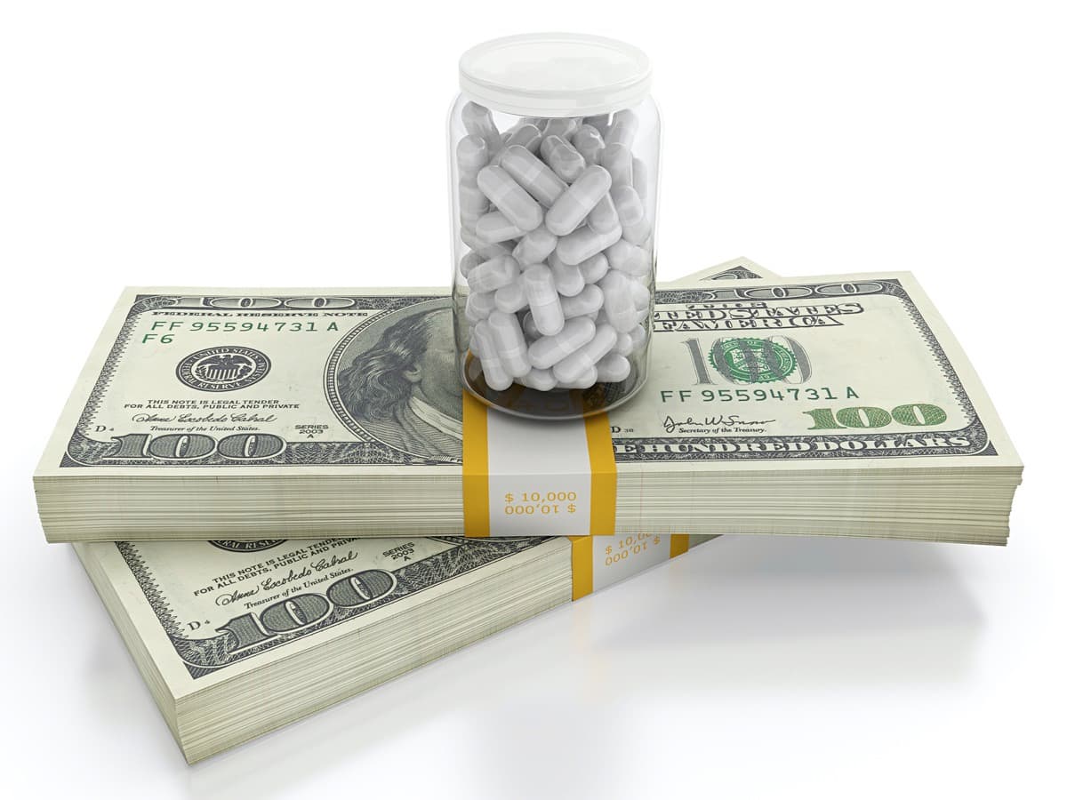 hundred dollar bills with pills