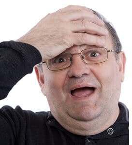 forgetful man slaps forehead