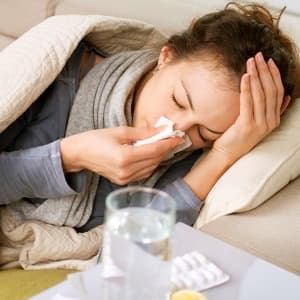 Sick Woman.Flu.Woman Caught Cold. Sneezing into Tissue. Headache. Virus .Medicines
