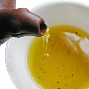 green tea being poured from a teapot