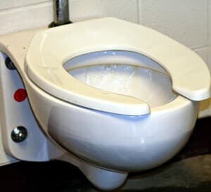 clogged toilet full of poop