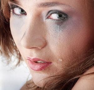sad and depressed young woman crying