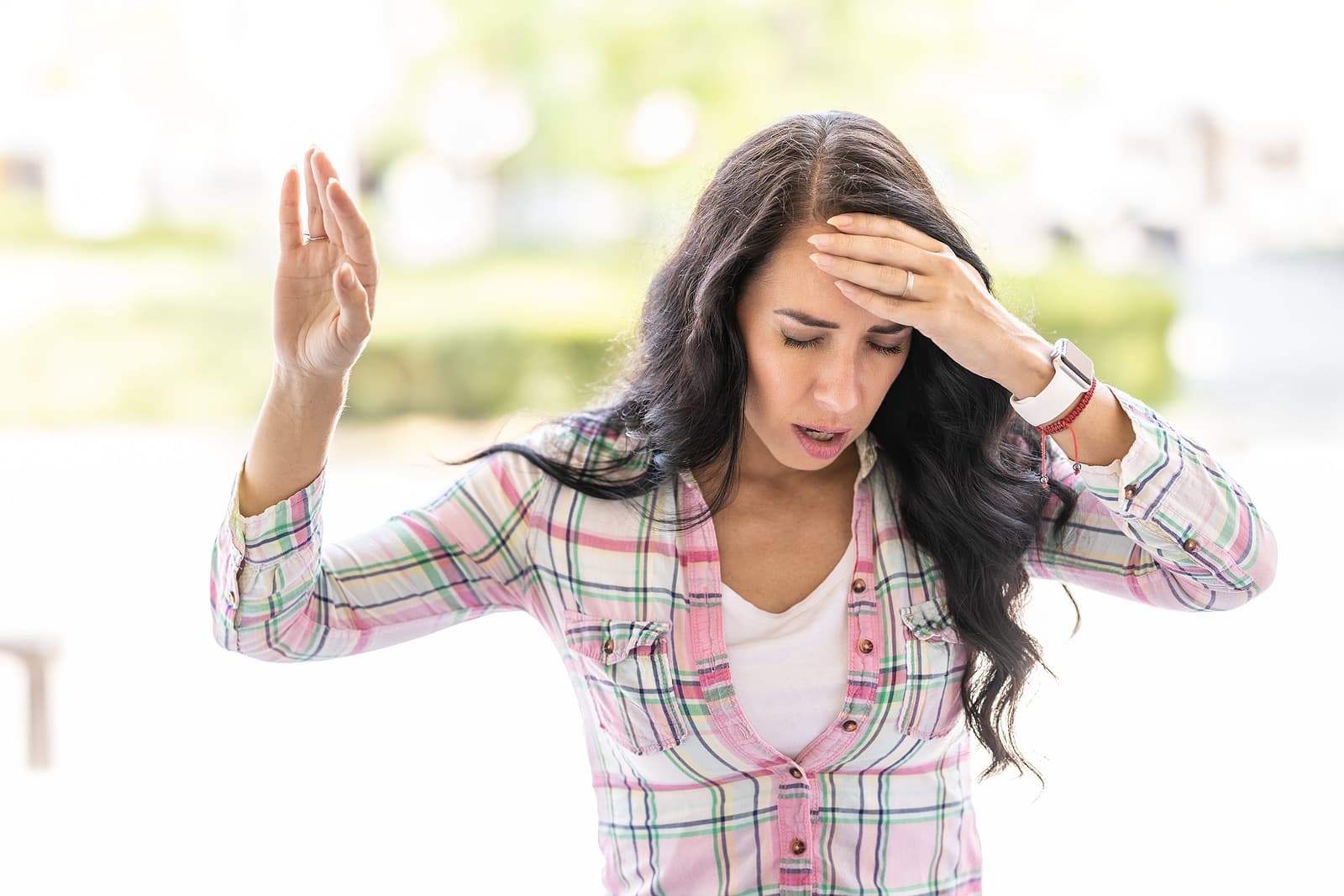 young woman suddenly feels dizzy