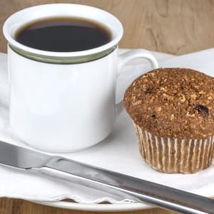 Fresh baked bran and flax muffin and coffee