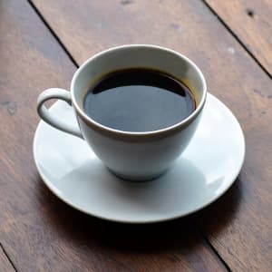 a cup of coffee on a saucer