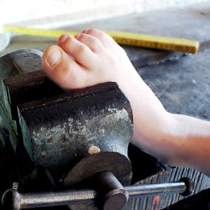 Foot in a vice representing diabetic nerve pain