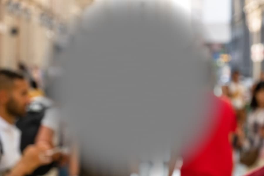 Image of crowd with center obscured replicates age-related macular degeneration