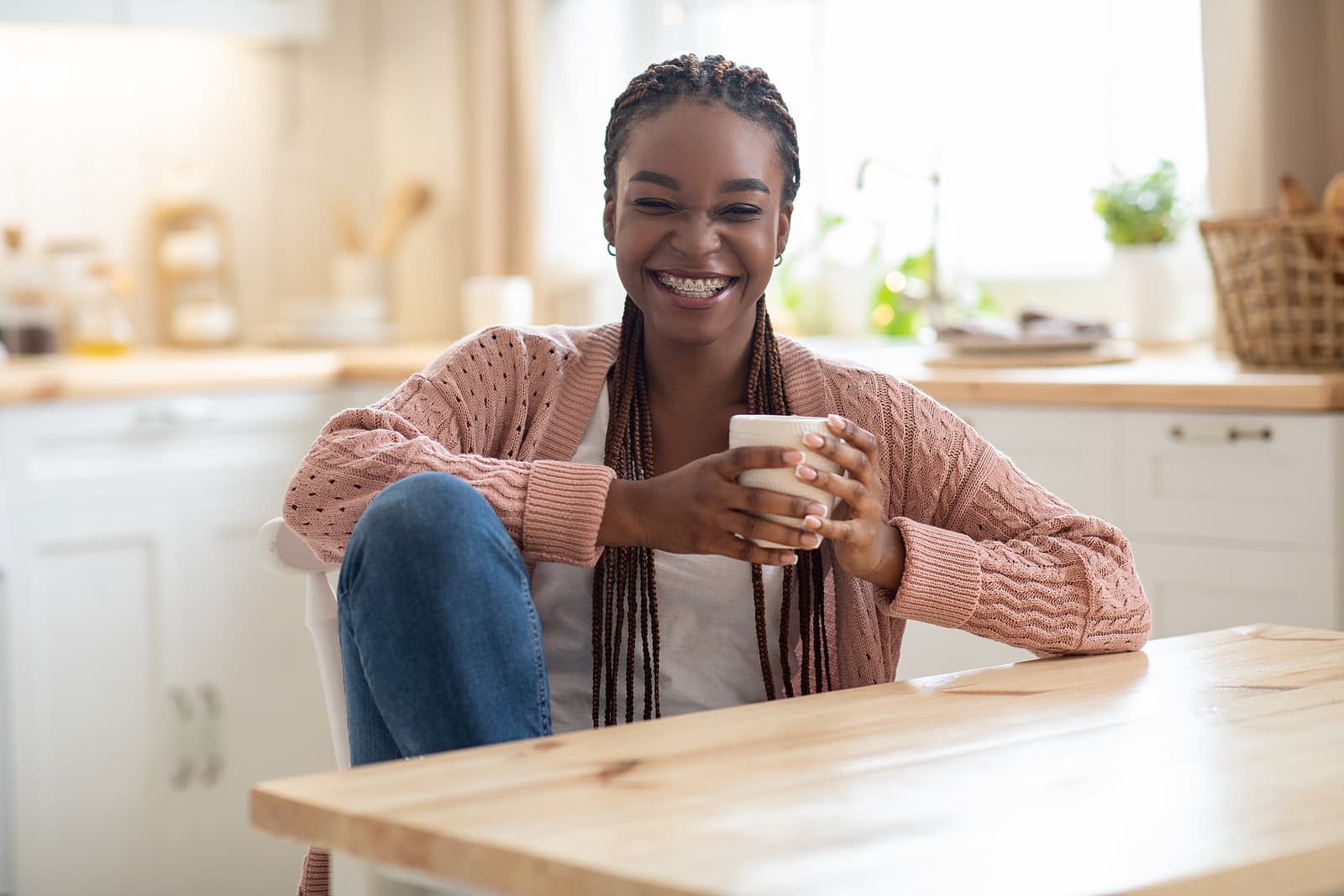 Young woman drinking coffee for benefits of caffeine consumption