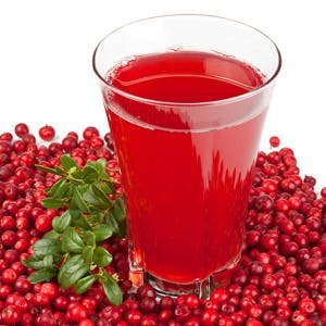 Fresh cranberry and berry juice glass on a white background
