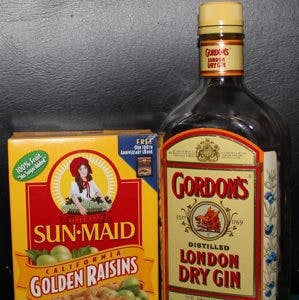 Golden raisins in box and Gordon&#8217;s gin bottle gin-soaked raisins arthritis
