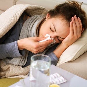 Sick Woman.Flu.Woman Caught Cold. Sneezing into Tissue. Headache. Virus .Medicines

