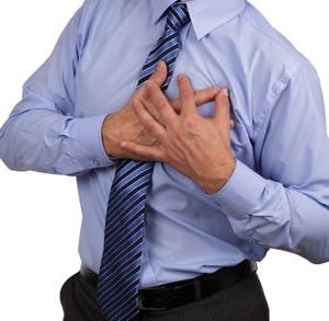 Businessman with chest pain clutching his chest concept for heart attack, stoke or asthmatic
