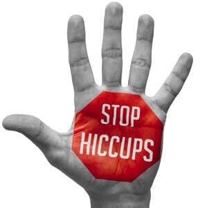 Stop Hiccups &#8211; Red Sign Painted &#8211; Open Hand Raised, Isolated on White Background.
