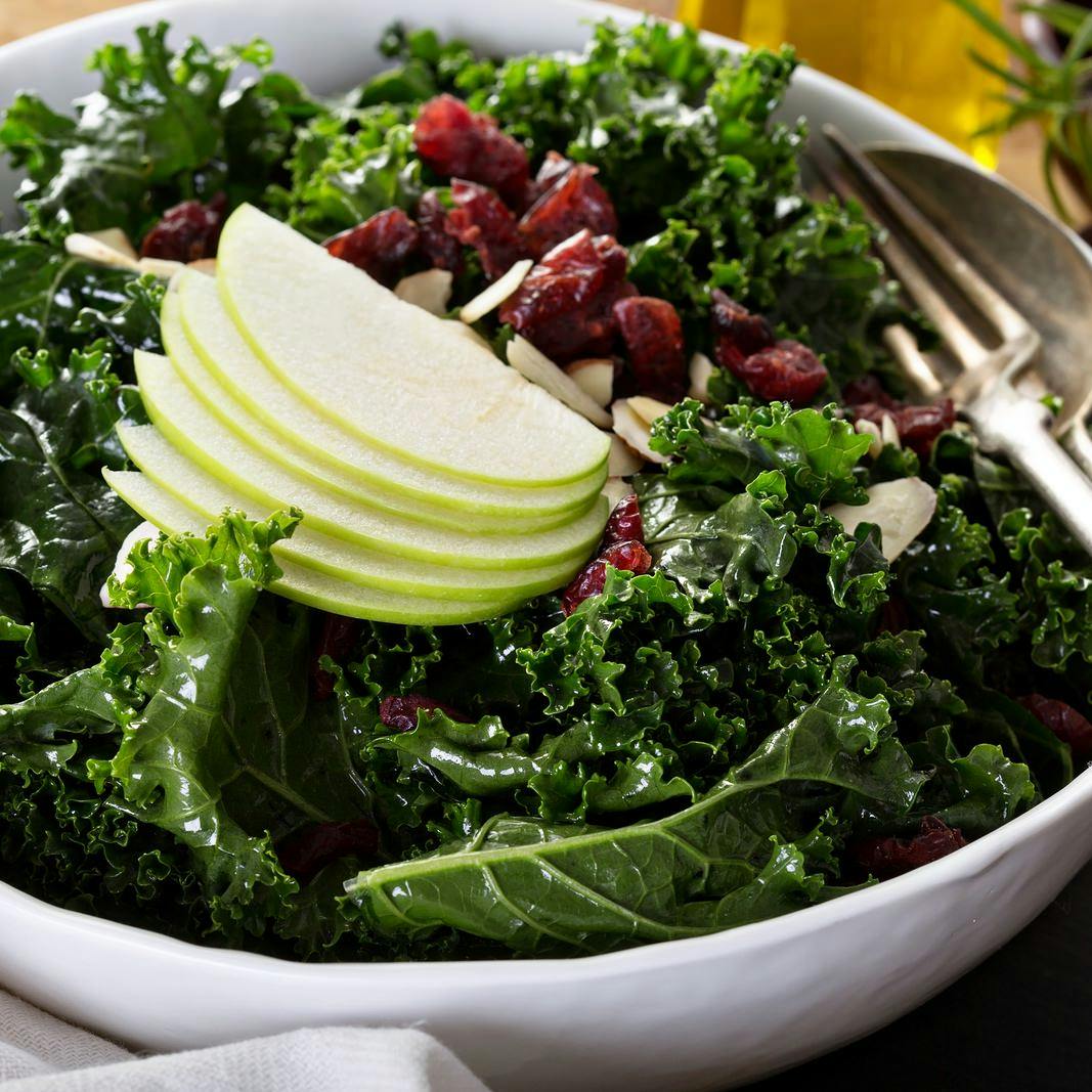 Kale salad with dried cranberry, almonds and apple