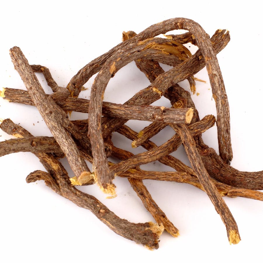 Raw liquorice roots isolated at white background
