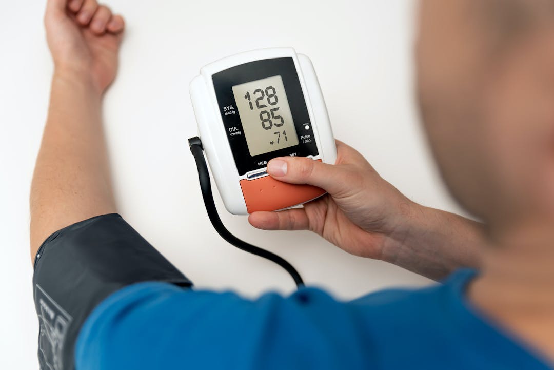 Man check blood pressure. Self care heart rate monitoring with digital pressure gauge.

