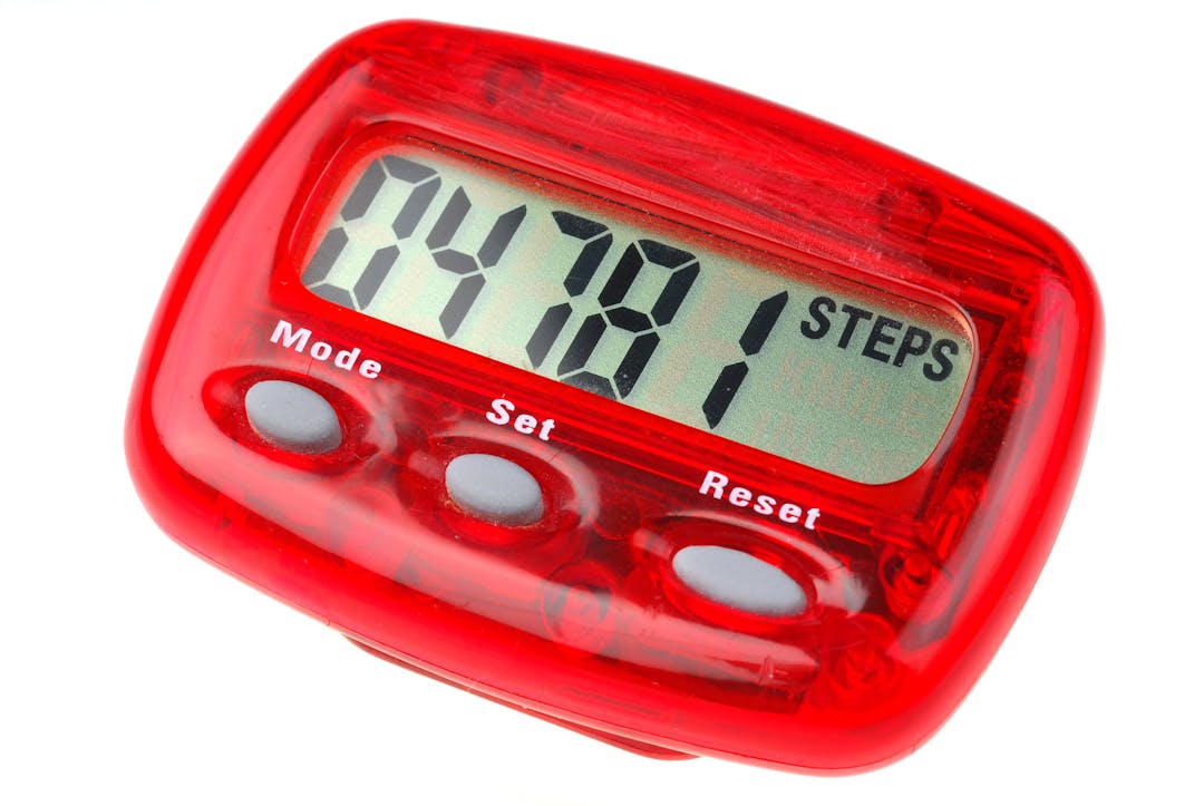 Red pedometer studio isolated on white background
