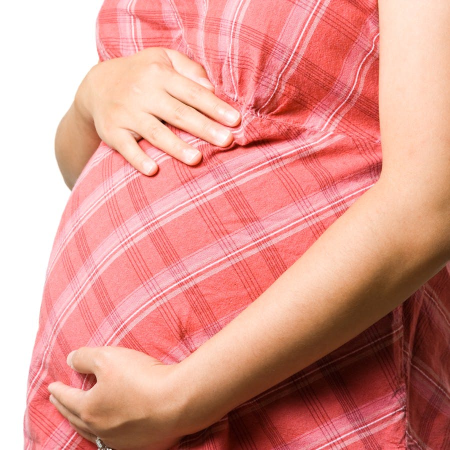 An isolated shot of a pregnant woman
