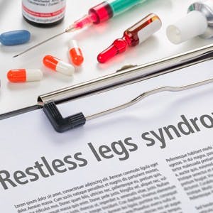 The diagnosis Restless legs syndrome written on a clipboard
