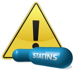 Statin pills and a warning sign, 3D graphic