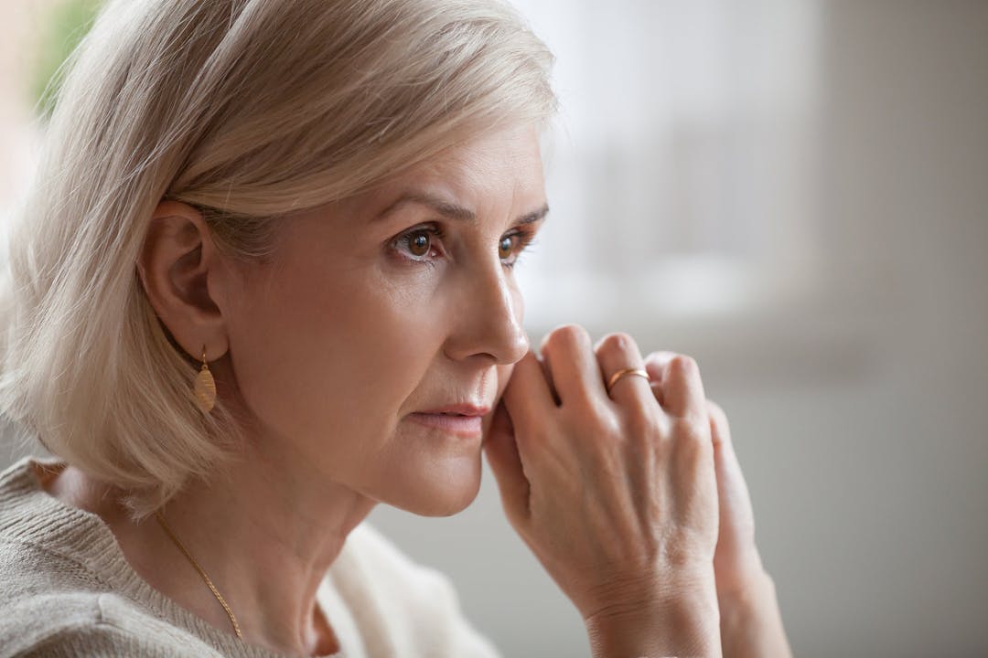 Thoughtful serious anxious mature senior woman feeling worried a
