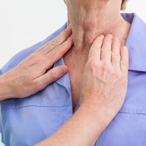 Problems with thyroid nurse examining a patient
