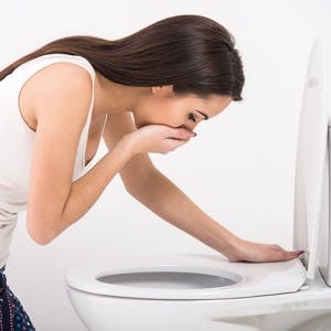 Young woman suffering from morning sickness