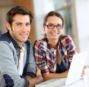 young couple reading email newsletter or online shopping