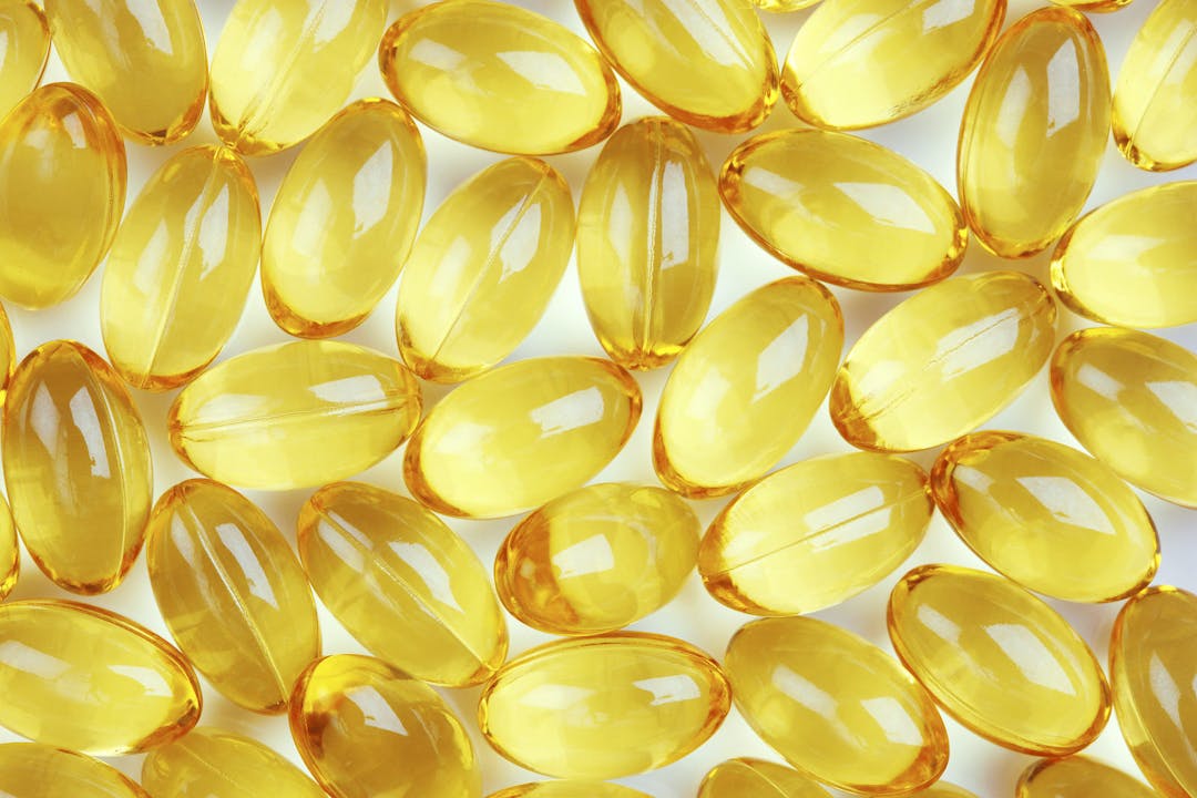 Healthy fish oil nutritional supplements pills / close-up macro
