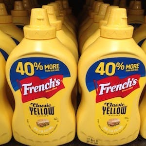 rows of yellow mustard on a store shelf