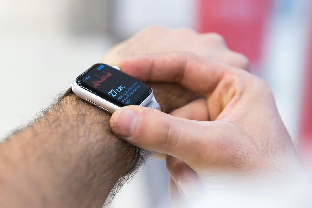 Belgrade, Serbia &#8211; January 30, 2019: Apple Watch Series 4 is displayed on hand. Close up of wristwatch with new ECG application on the screen showing heart rate just started with fingers.
