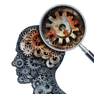 Brain decline and dementia or aging as memory loss concept for brain cancer decay or an Alzheimer&#8217;s disease with the medical icon of a old rusting mechanical gears and cog wheels of metal in the shape of a human head with rust.
