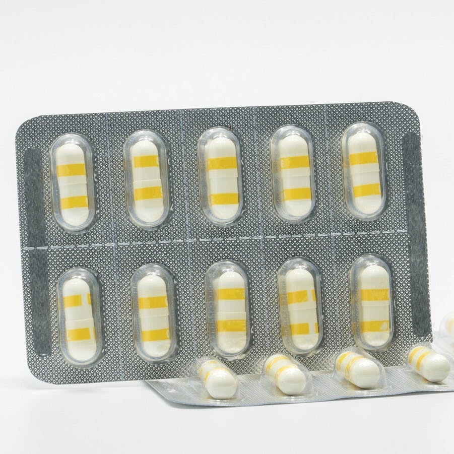 Anti-inflammatory medicine capsule pills on white background
