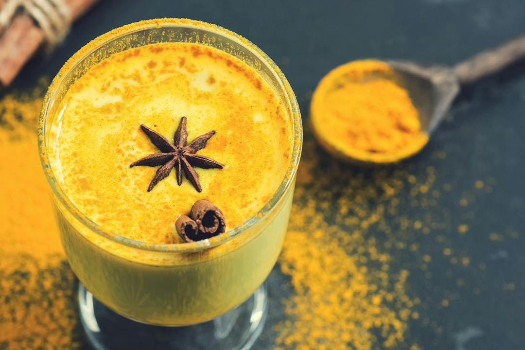 Drink with turmeric and anise star cinnamon &#8211; golden milk. Antioxidant. A warming drink due to flu and colds. Selective focus
