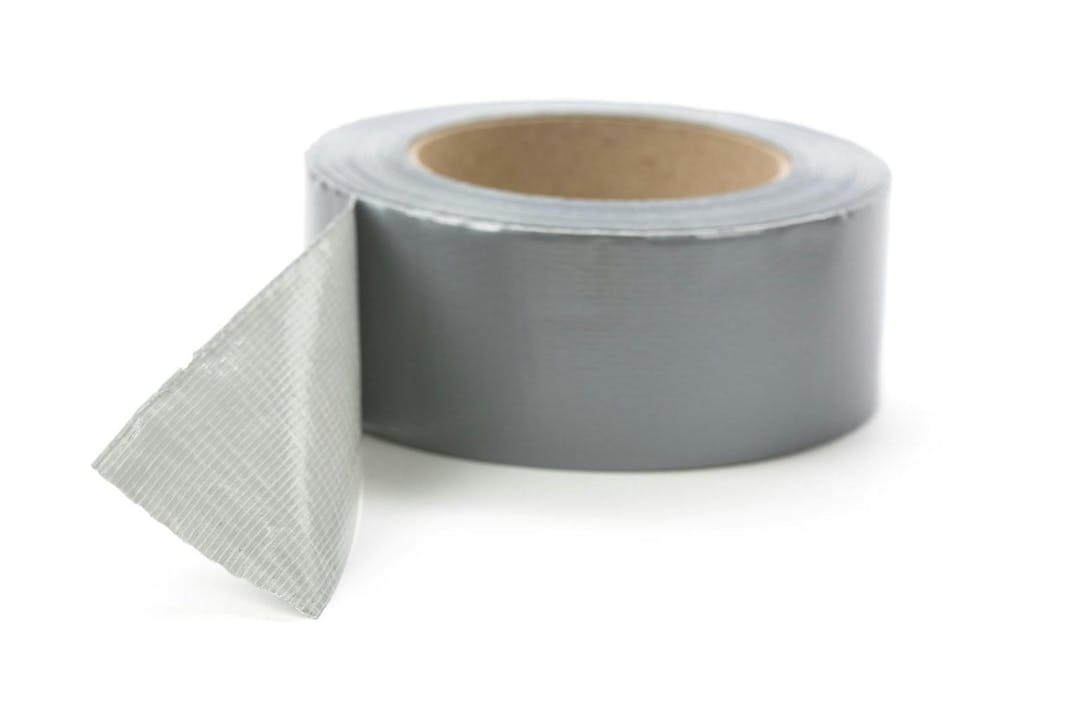 A roll of Grey Duct Tape with white background
