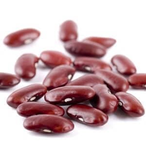 Stack of kidney beans on white background close up.

