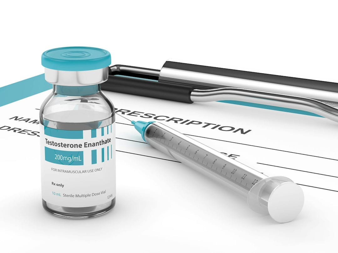 3d render of testosterone enanthate vial with syringe lying on clipboard with prescription. Anabolic steroids concept.
