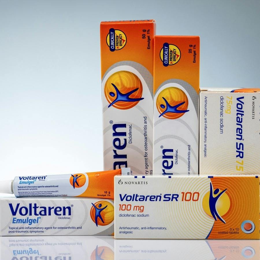 CHONBURI, THAILAND-OCTOBER 11, 2018 : Voltaren Emulgel and Voltaren tablets. 1% diclofenac gel for topical anti-inflammatory and diclofenac sodium on white background. Painkiller, analgesic pills.
