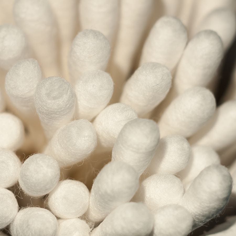 Close up macro of white cotton wool ear buds q tip ends; essex; england; uk
