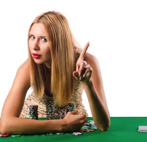 Young woman in casino gambling concept
