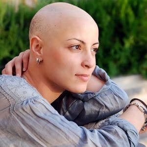 A female cancer patient with no hair,
