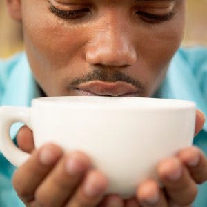 Close up of man drinking coffee
