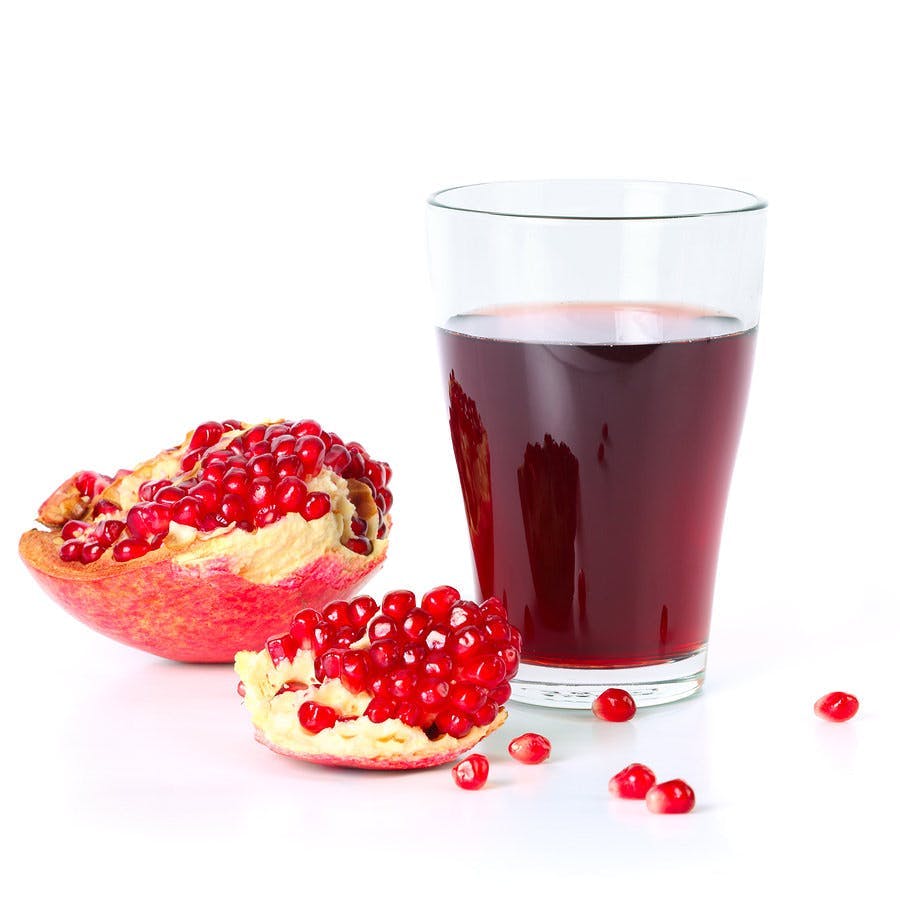 Fresh half of pomegranate juice on an isolated background
