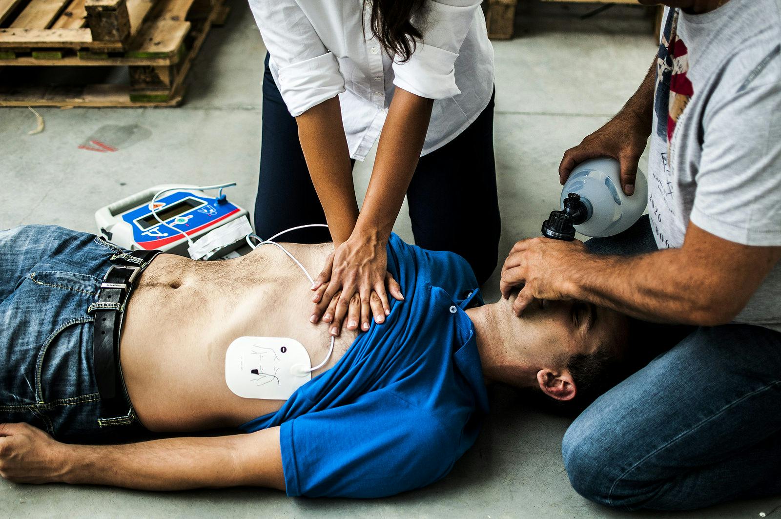 man having a heart attack undergoing CPR