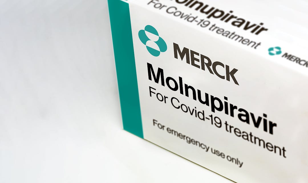 New York, USA, October 2021: Merck Covid-19 Molnupiravir treatment box isolated on a white background. Health and prevention.
